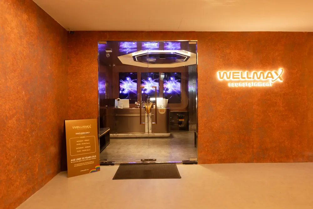 The illuminated WELLMAX sign above the entrance turnstiles at B1, Wall Street Tower, Surawong, Bangkok